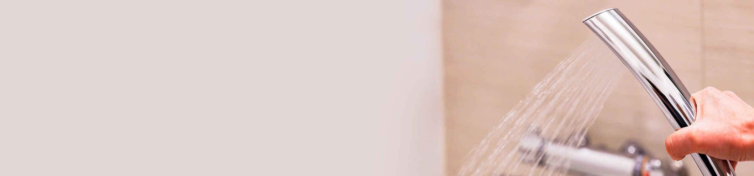 Plumber fixing tap in bathroom John G. Plumbing Drain and Sewer Cleaning