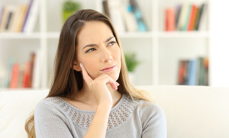 A plumber installing a toilet