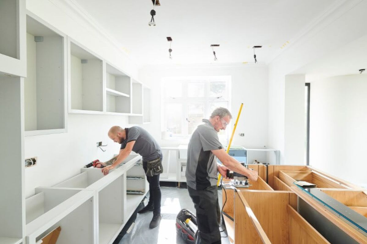 John G. Plumbing two men renovating a kitchen