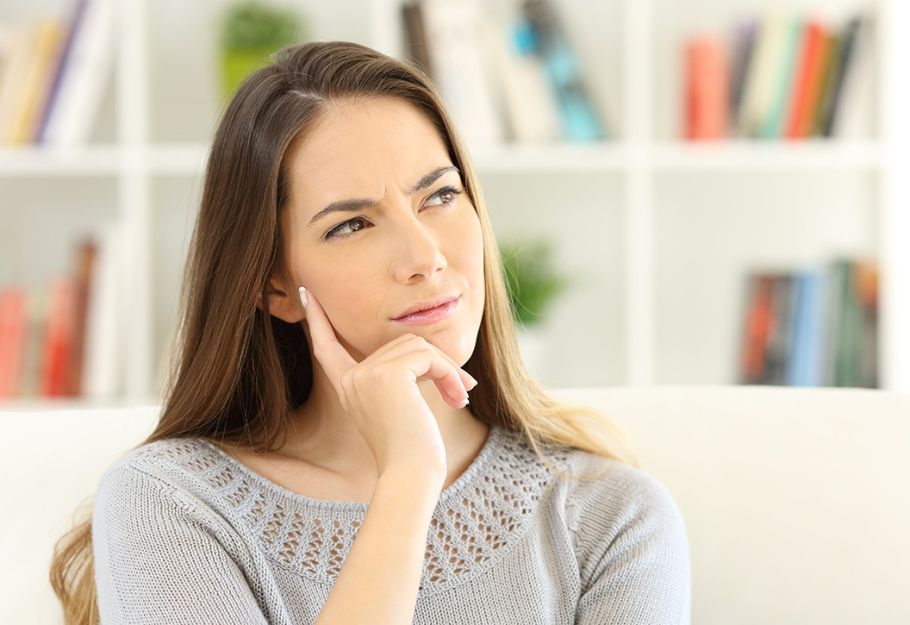 A plumber installing a toilet