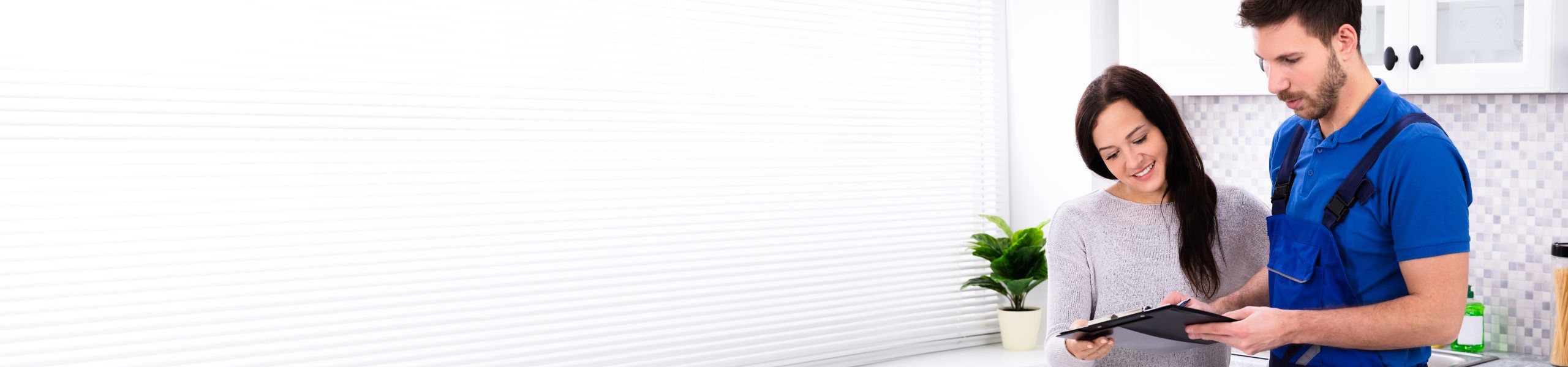 Plumber with client John G. Plumbing Current Promotions and Rebates