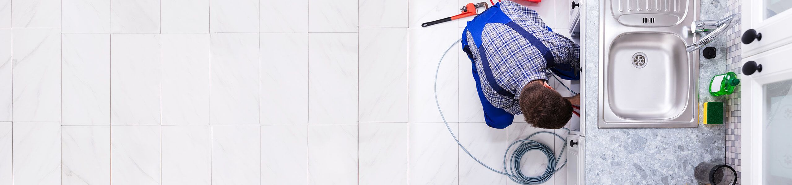 Plumber fixing pipe John G. Plumbing Drain and Sewer Cleaning