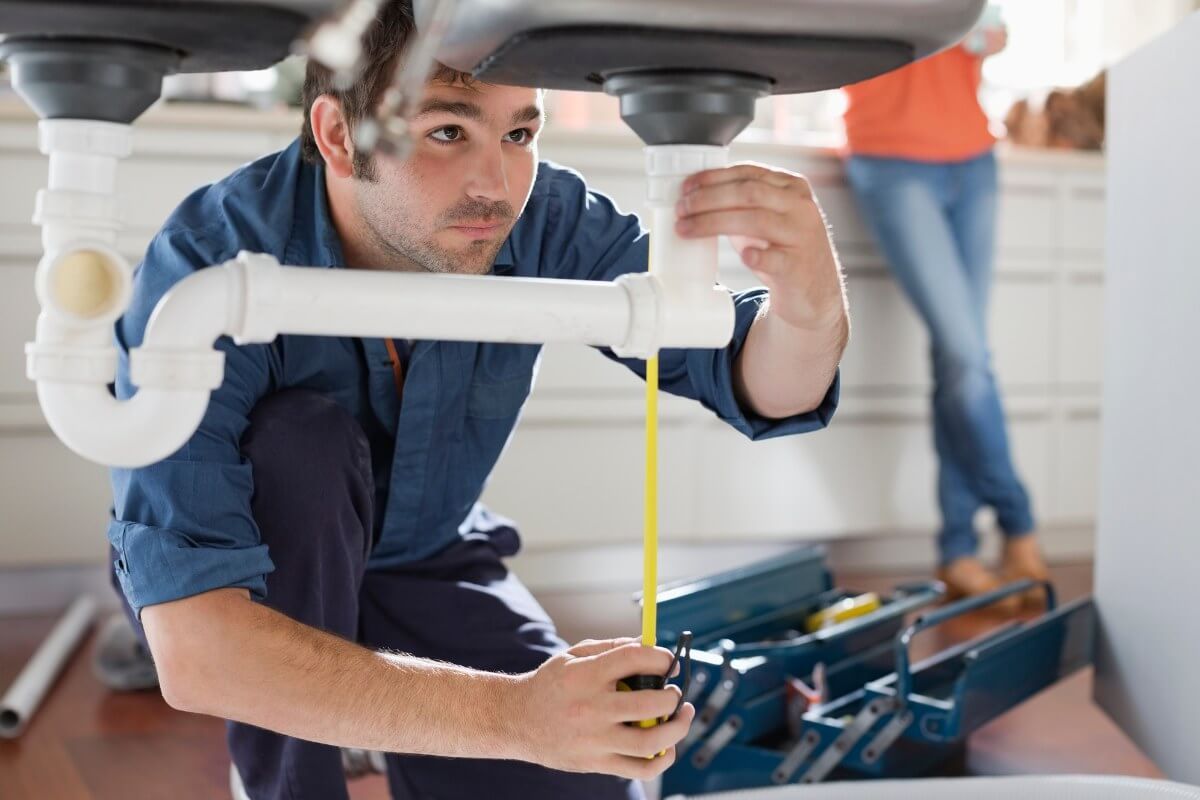 John G. Plumbing working on client sink John G. Plumbing Coombs