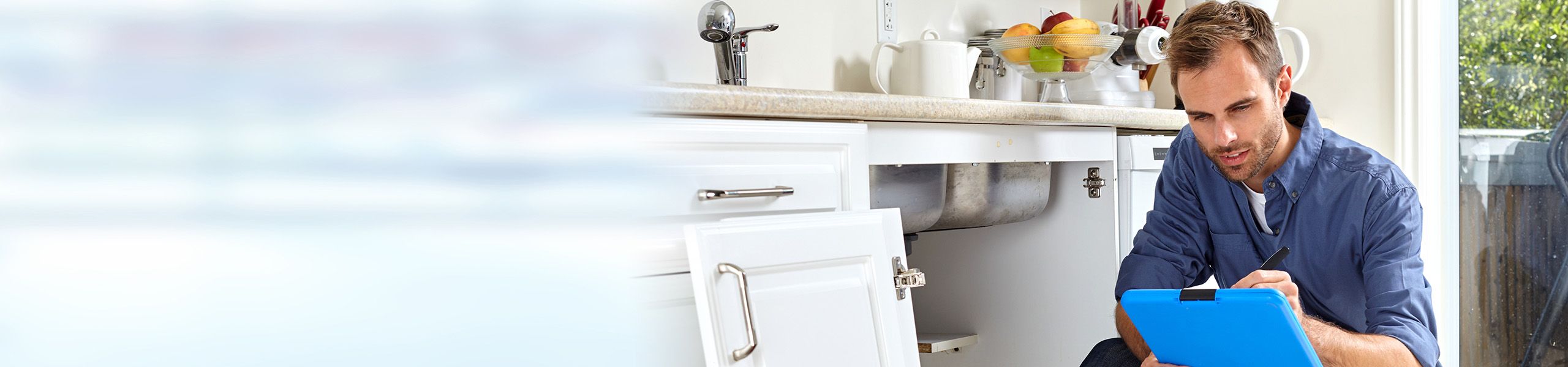 Plumber writing on clipboard John G. Plumbing Employment Opportunity