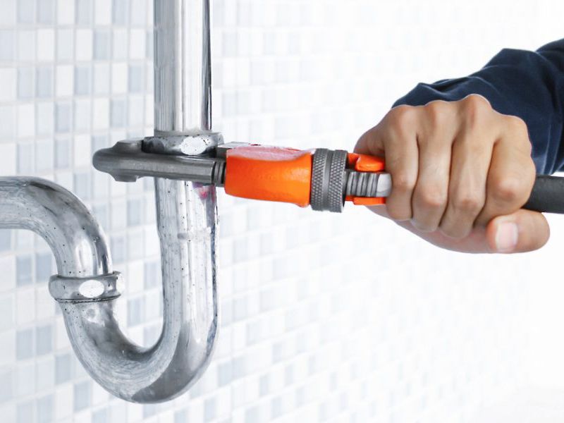 Plumber fixing pipe John G. Plumbing Drain and Sewer Cleaning