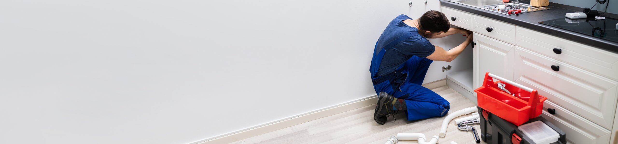 Plumber fixing pipe John G. Plumbing Drain and Sewer Cleaning