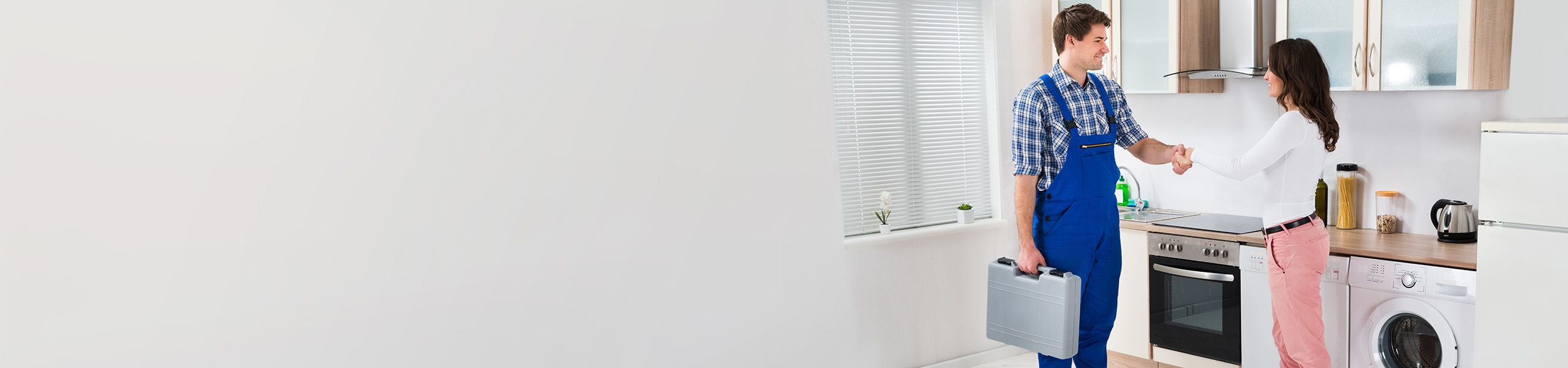 Plumbers shaking client's hand John G. Plumbing Gas & Plumbing Coupons