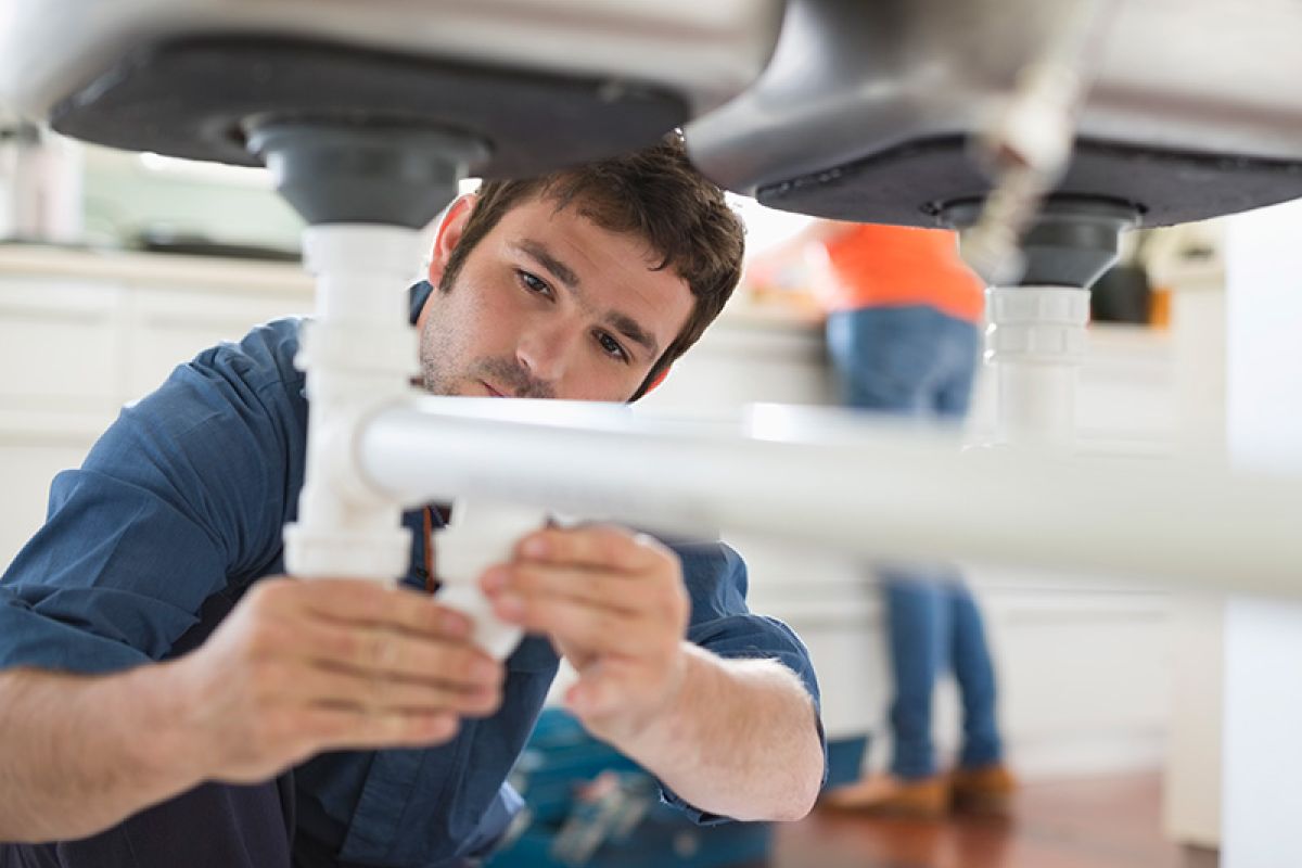 John G. Plumbing working on client sink John G. Plumbing Coombs
