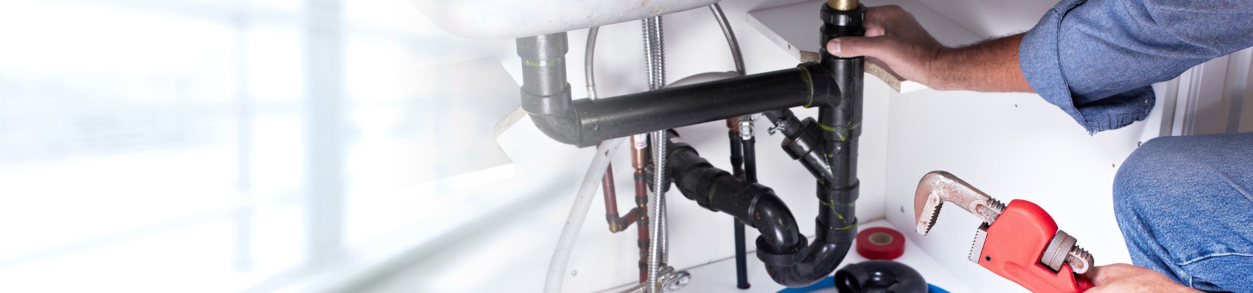 Plumber fixing pipe John G. Plumbing Drain and Sewer Cleaning