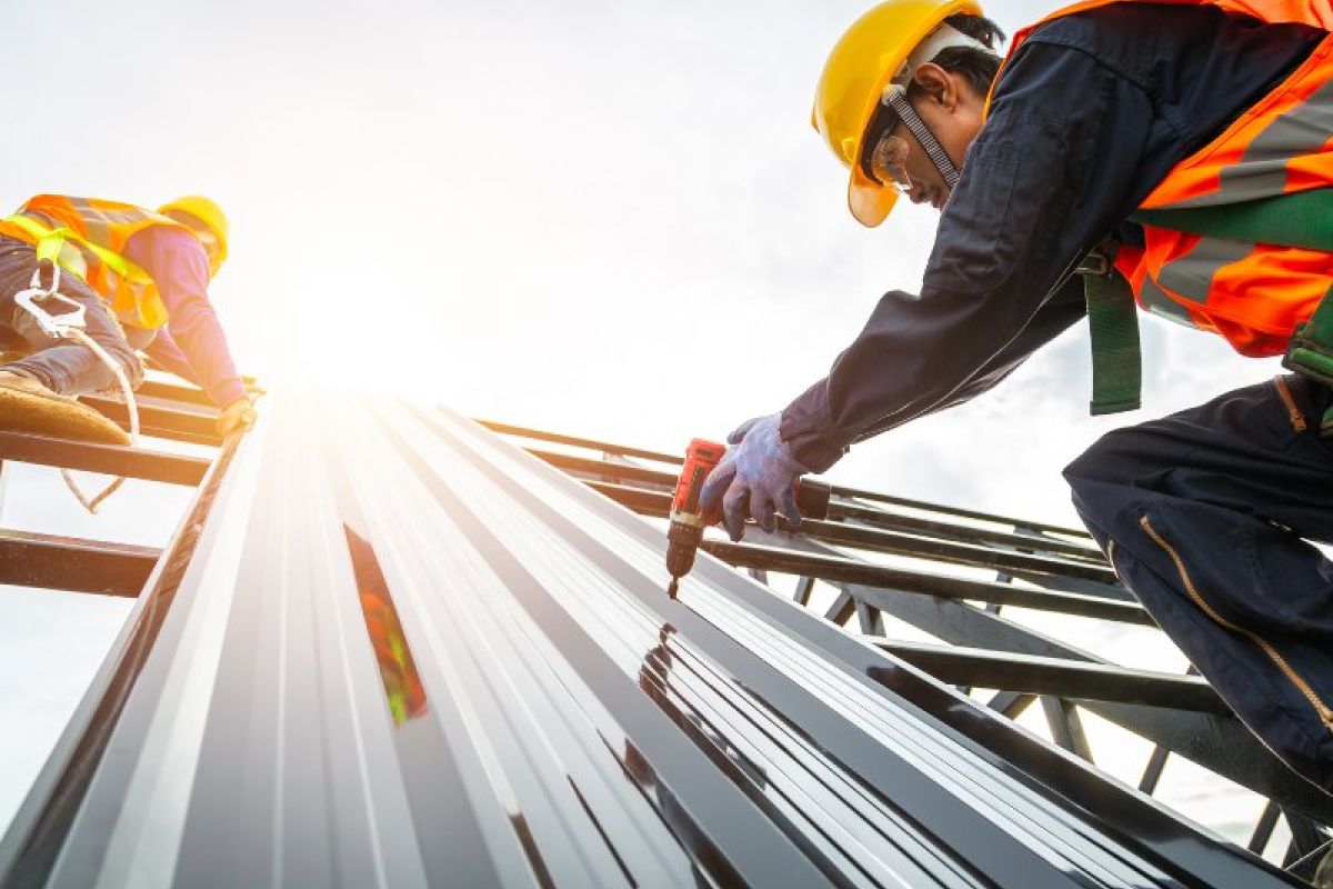 John G. Plumbing construction worker working on building