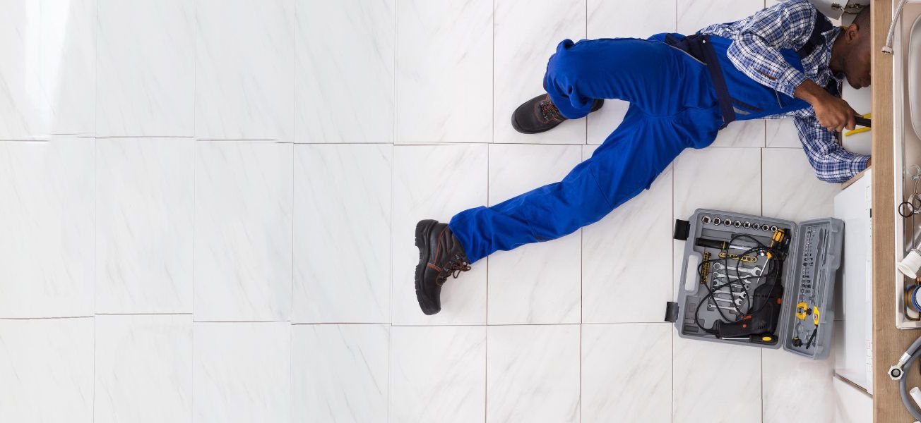 Plumber fixing sink John G. Plumbing Gas & Plumbing Coupons Coupons