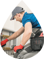 Plumber working on kitchen sink John G. Plumbing Drain and Sewer Cleaning