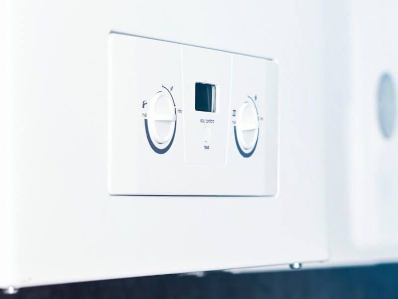 Plumber fixing tap in bathroom John G. Plumbing Drain and Sewer Cleaning