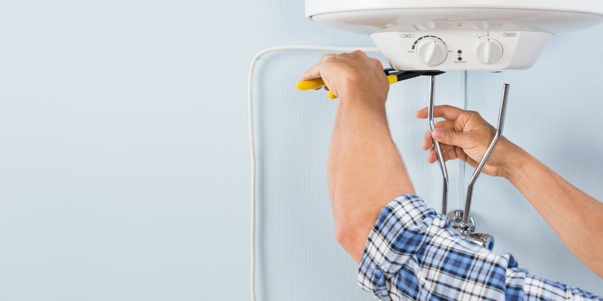 Plumber fixing pipe John G. Plumbing Drain and Sewer Cleaning