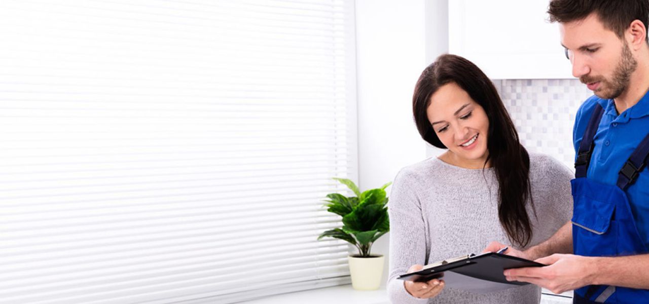 Plumber with client John G. Plumbing Current Promotions and Rebates