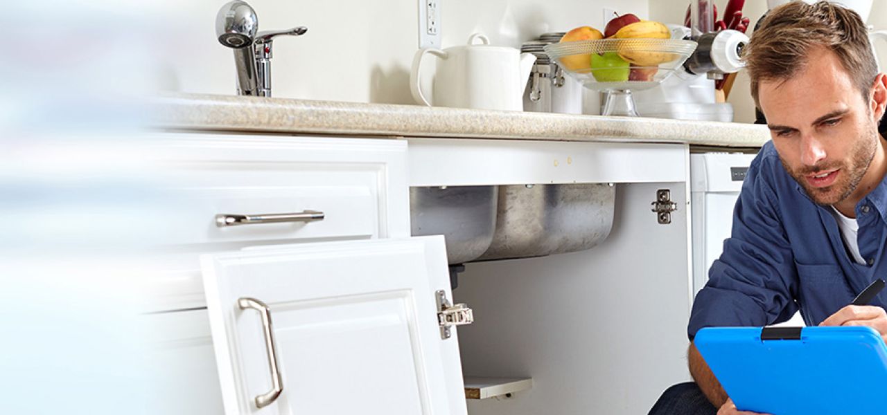 Plumber writing on clipboard John G. Plumbing Employment Opportunity