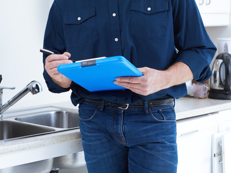 Plumber fixing pipe John G. Plumbing Drain and Sewer Cleaning